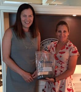 CCC President Patti Miller (l) and MP Chrystia Freeland in China with canola from Freeland's father's farm in Alberta.