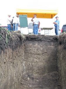 Ross McKenzie used freshly-dug soil pits to demonstrate how soil changes with depth.