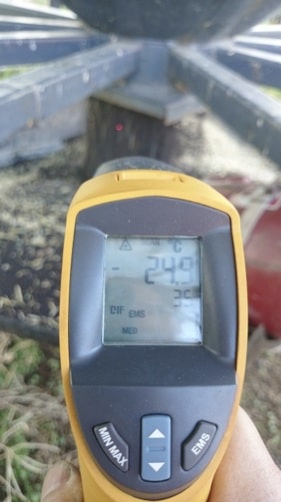 As the turned grain was removed, the grain temperature was taken